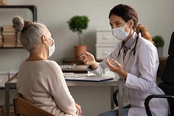 © Shutterstock Close,Up,Serious,Doctor,Wearing,Medical,Face,Mask,Consulting,Mature